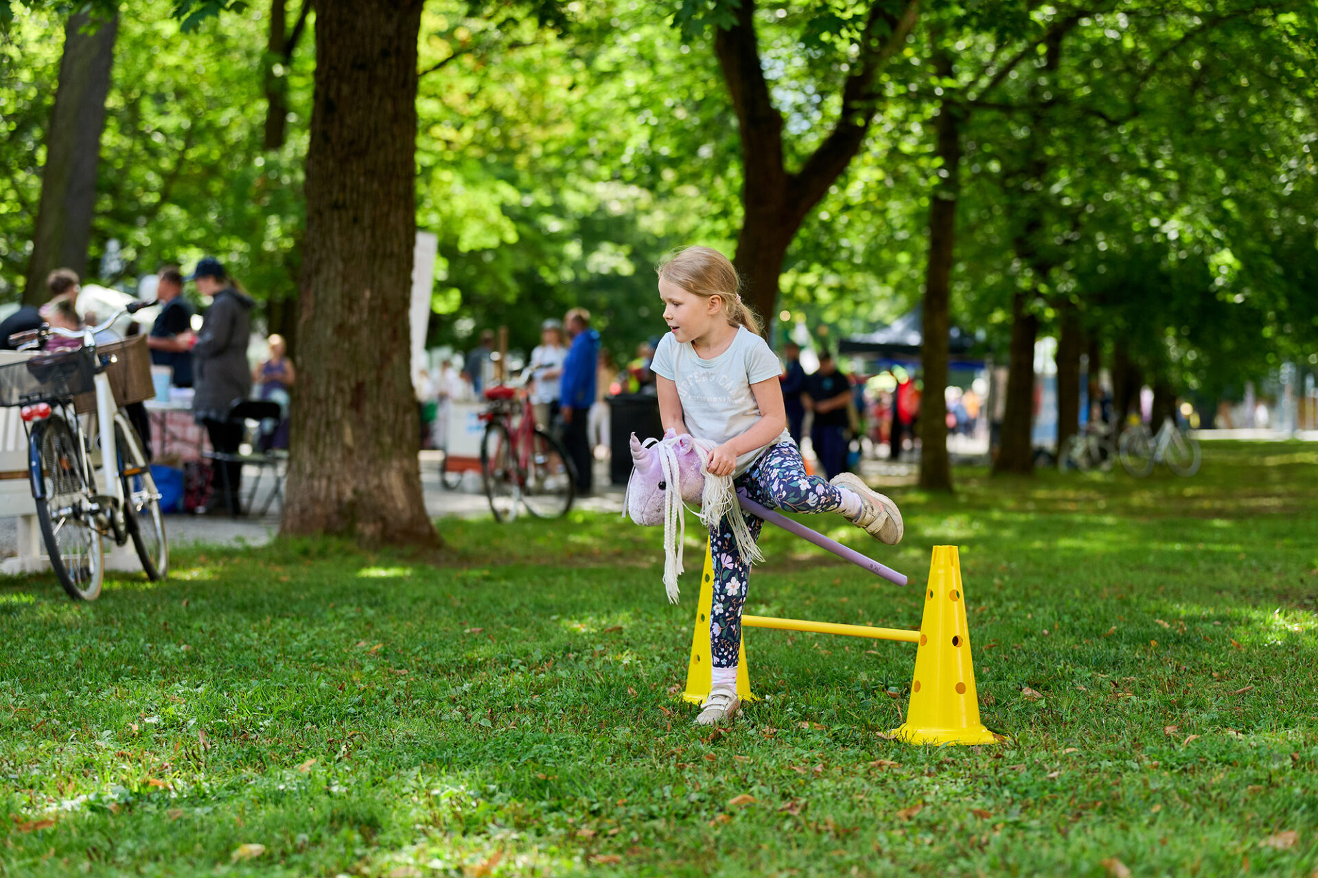 A child trying hobby horsing.